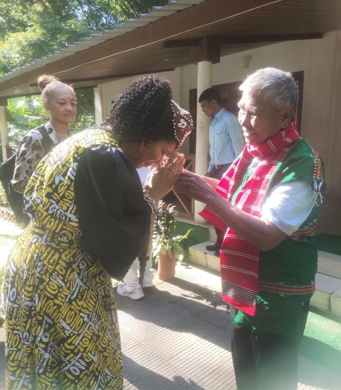 International tourists experiencing community-based tourism with local people in traditional Indian villages promoting responsible sustainable travel.
